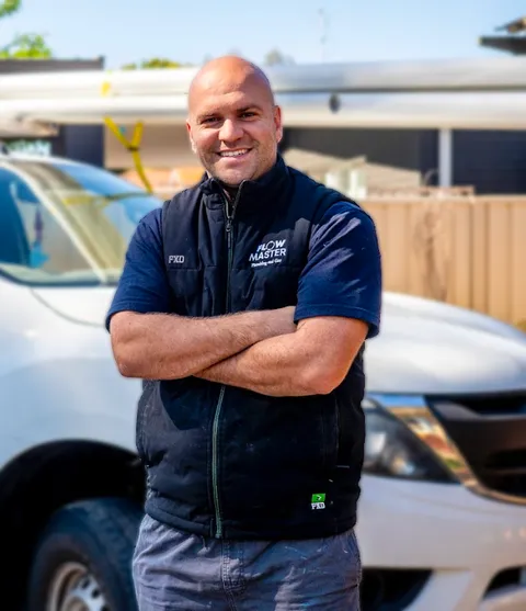Tradie standing with folded arms